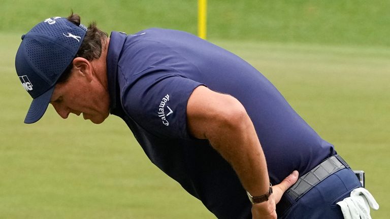 Phil Mickelson reacts to a missed birdie putt on the 16th green during the third round of the Masters golf tournament on Saturday, April 10, 2021, in Augusta, Ga. (AP Photo/Charlie Riedel)