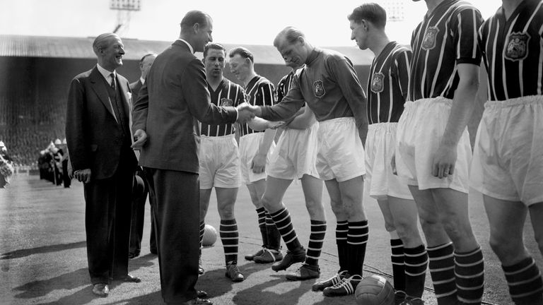 The Duke of Edinburgh shakes hands with Manchester City's Footballer of the Year Bert Trautmann, as he meets the teams before the FA Cup final against Birmingham at Wembley in 1956