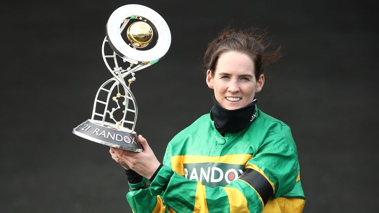 Jockey Rachael Blackmore receives the Randox Grand National Handicap Chase trophy after winning on Minella Times