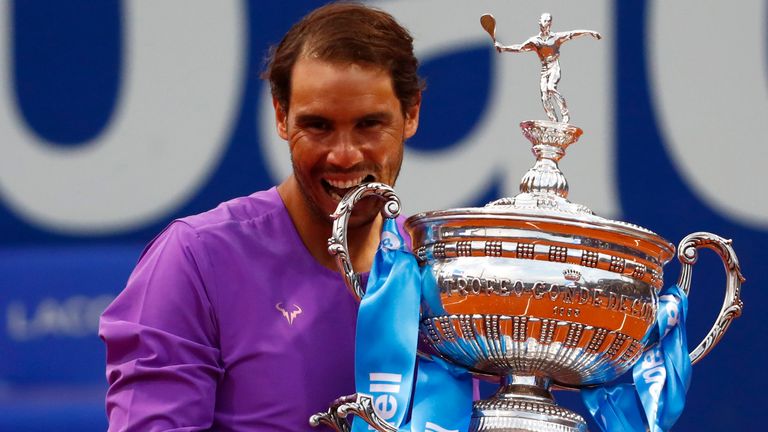 Rafael Nadal of Spain poses for a photo holding the trophy after winning the final Godo tennis tournament against Stefanos Tsitsipas of Greece in Barcelona, Spain, Sunday, April 25, 2021. Nadal won by 6-4, 6-7, 7-5 (AP Photo/Joan Monfort)