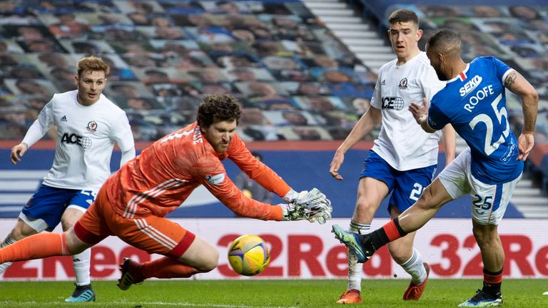 Rangers' Kemar Roofe (R) makes it 2-0 during the Scottish Cup third-round tie against Cove Rangers