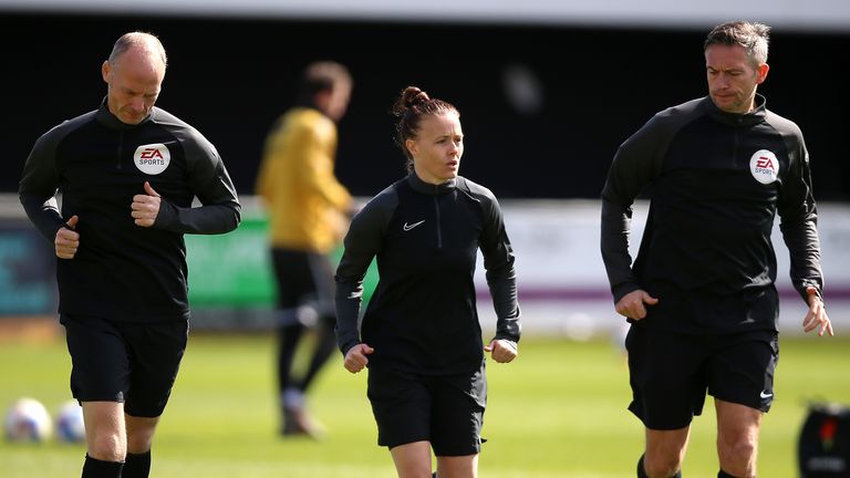 Rebecca Welch (centre) warms up prior to the League Two match