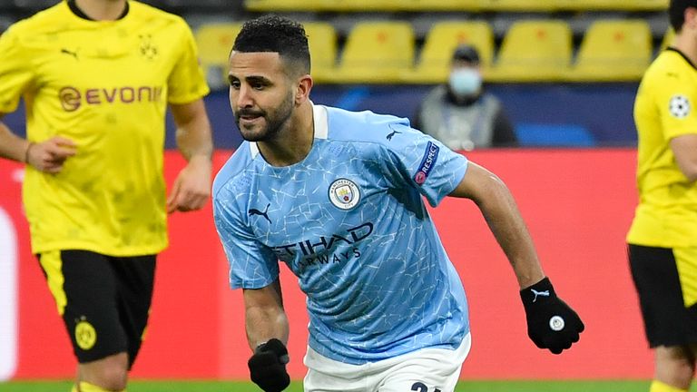 Manchester City's Riyad Mahrez celebrates after scoring his side's first goal during the Champions League quarterfinal second leg soccer match between Borussia Dortmund and Manchester City at the Signal Iduna Park stadium in Dortmund