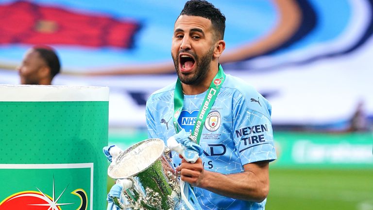 Riyad Mahrez celebrates with the trophy after winning the Carabao Cup