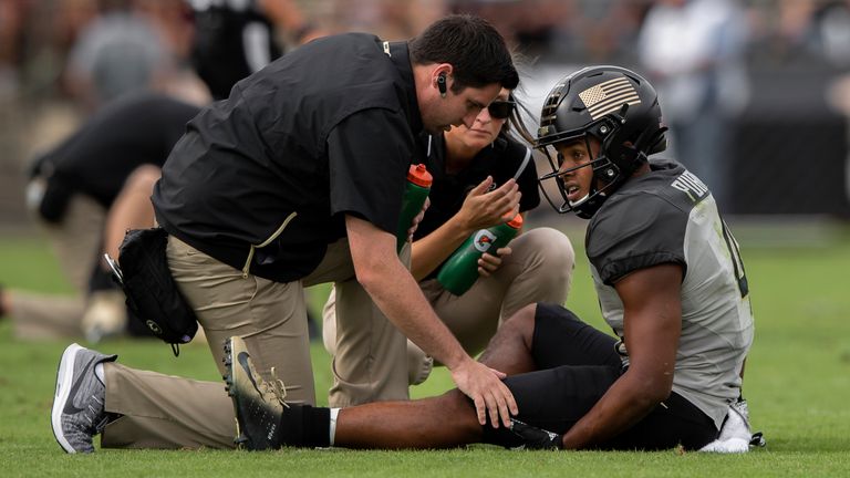Purdue Boilermakers wide receiver Rondale Moore (4) gets checked out by trainers after getting injured during the college football game between the Purdue Boilermakers and Minnesota Golden Gophers on September 27, 2019, at Ross-Ade Stadium in West Lafayette, IN. (Photo by Zach Bolinger/Icon Sportswire) (Icon Sportswire via AP Images)
