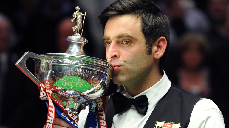 Ronnie O'Sullivan celebrates his victory with the trophy after the final during the Final of the Betfred.com World Snooker Championships at the Crucible Theatre, Sheffield.
