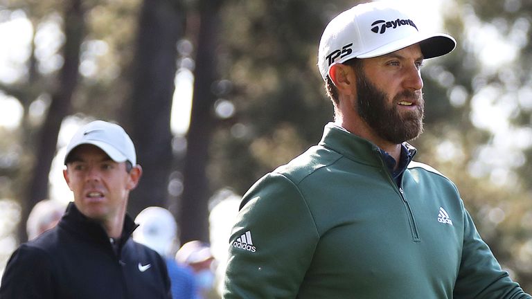 040521 Augusta: Defending Masters champion Dustin Johnson (right) and Rory McIlroy walk the fourth fairway after teeing off during their practice round for the Masters at Augusta National Golf Club on Monday, April 5, 2021, in Augusta.   ...Curtis Compton / Curtis.Compton@ajc.com...