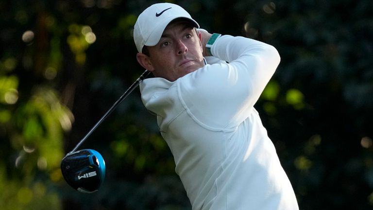 Rory McIlroy, of Northern Ireland, watches his tee shot on the 11th hole during a practice round for the Masters