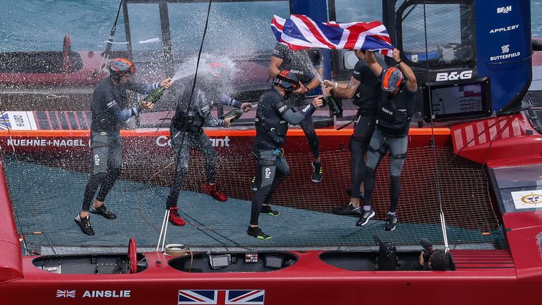 The British team celebrating on board after their final victory (Image Credit - Simon Bruty for SailGP)