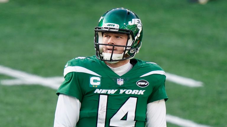 New York Jets quarterback Sam Darnold (14) walks on the field during the first half of an NFL football game against the Cleveland Browns in East Rutherford, N.J. 