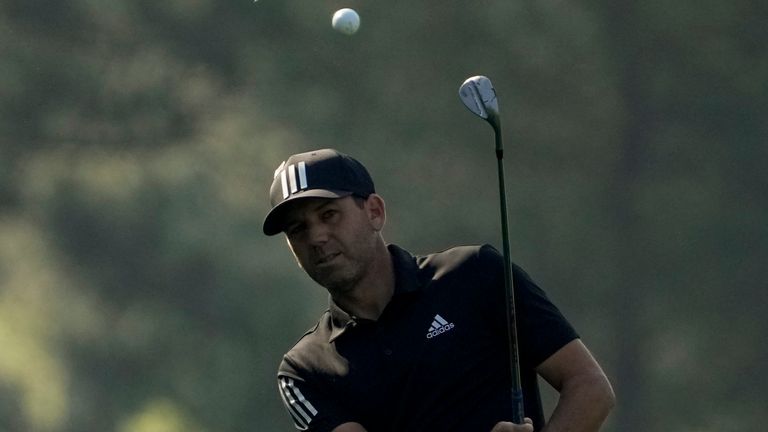 Sergio Garcia, of Spain, chips to the green on the third hole during a practice round for the Masters 