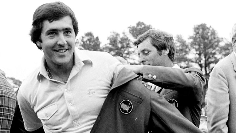 Seve Ballesteros of Spain, left, is helped with his Masters green jacket by the previous year's winner, Fuzzy Zoeller, right, after winning the 1980 Masters