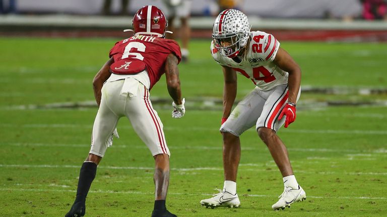 Wade lines up against Alabama receiver DeVonta Smith during the CFP National Championship game. (Photo by David Rosenblum/Icon Sportswire via AP)