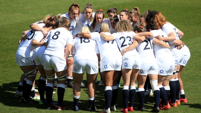 England players huddle together on the pitch ahead of the Guinness Women's Six Nations final against France