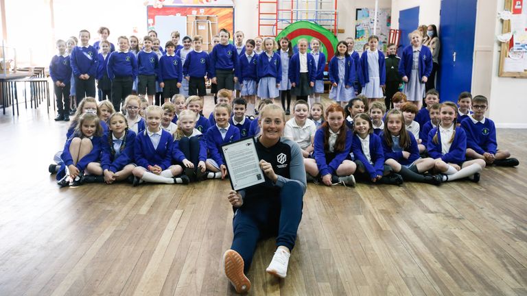 Sophie Ecclestone with the letter she read out at her old primary school at Helsby Hillside Primary School in Helsby (Credit: Tom Shaw for the ECB)