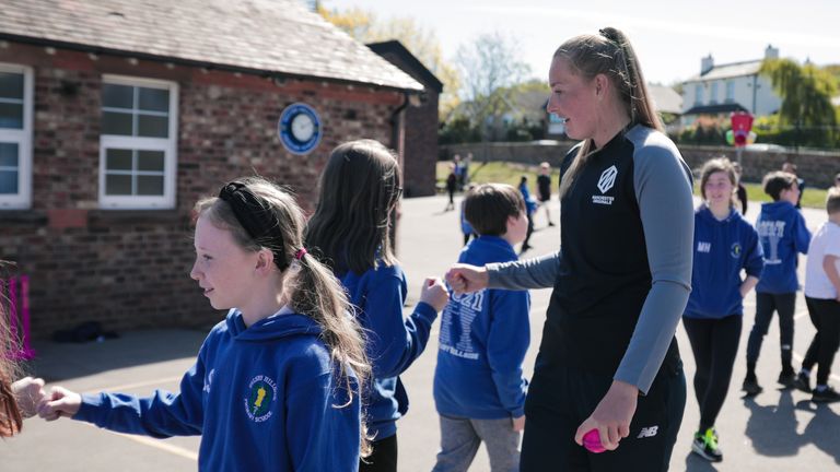 HELSBY, ENGLAND. 23 APRIL, 2021;  Sophie Ecclestone of England and Manchester Originals chats to childern at her old primary school at Helsby Hillside Primary School in Helsby, England on April 23, 2021. Mandatory Credit (Tom Shaw for the ECB)