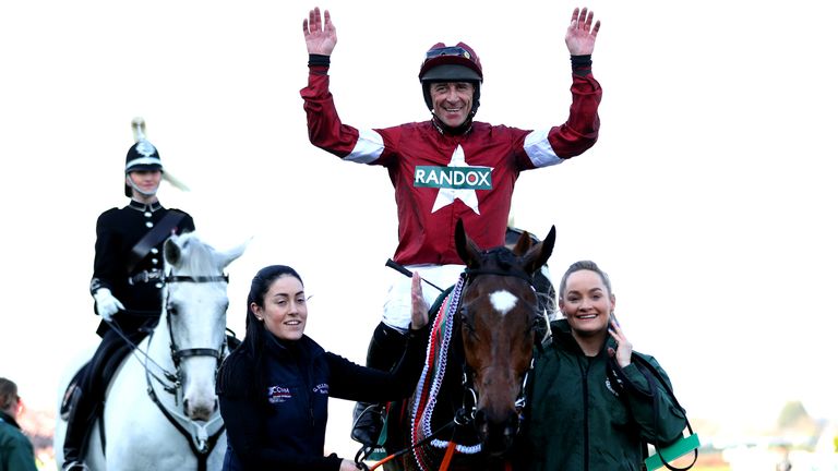 Jockey Davy Russell celebrates on Tiger Roll after winning Grand National in 2019