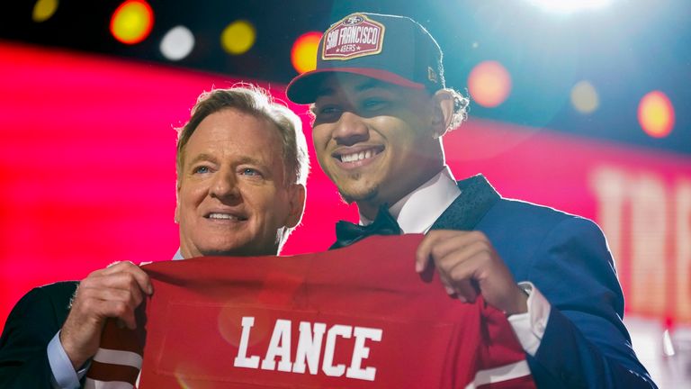 North Dakota State quarterback  Trey Lance, right, holds a team jersey with NFL Commissioner Roger Goodell after being chosen by the San Francisco 49ers with the third overall pick in the first round of the 2021 NFL football draft, Thursday April 29, 2021, in Cleveland. (AP Photo/Tony Dejak)