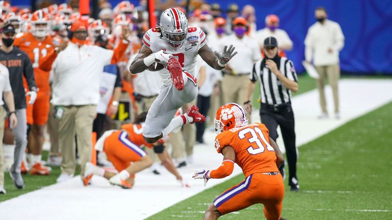 Sermon looks to hurdle Clemson defender Mario Goodrich. (Cal Sport Media via AP Images)