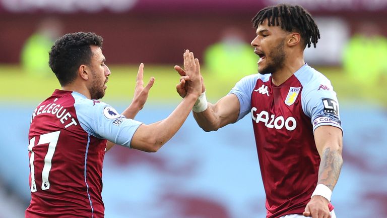 Trezeguet of Aston Villa celebrates with team-mate Tyrone Mings after scoring against Fulham