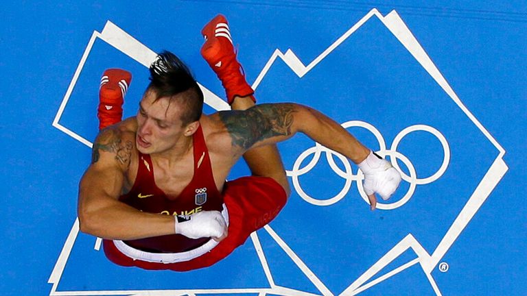 Ukraine's Oleksandr Usyk celebrates after defeating Italy's Clemente Russo to win the gold medal for the men's heavyweight 91kg boxing competition at the 2012 Summer Olympics, Saturday, Aug. 11, 2012, in London. (AP Photo/Mark Duncan)