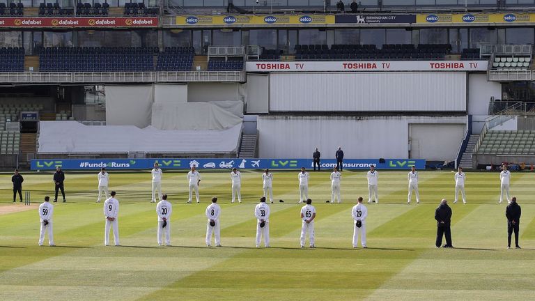 Warickwhire and Derbyshire players held a moment of unity before the start of their County Championship match on Thursday (PA)