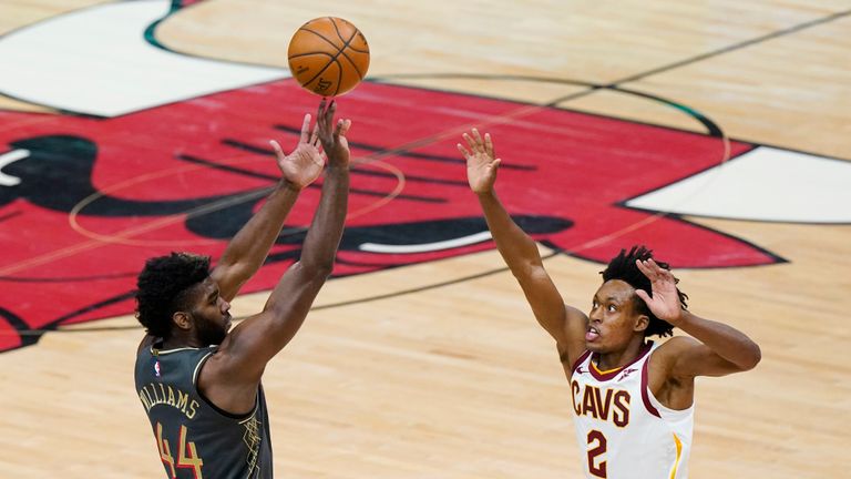 Chicago Bulls forward Patrick Williams, left, shoots over Cleveland Cavaliers guard Collin Sexton during the first half of an NBA basketball game in Chicago, Saturday, April 17, 2021. (AP Photo/Nam Y. Huh)