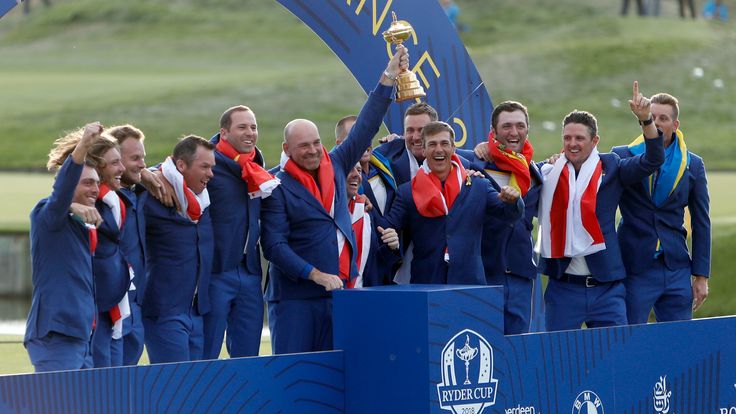 Europe team captain Thomas Bjorn holds up the trophy after the European won the 2018 Ryder Cup golf