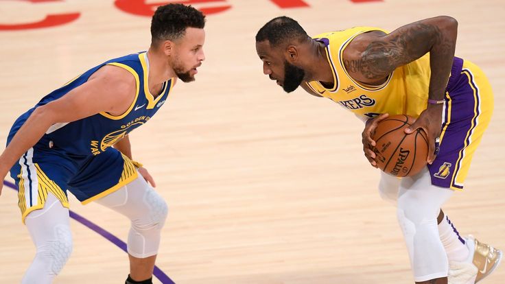 Steph Curry guards LeBron James