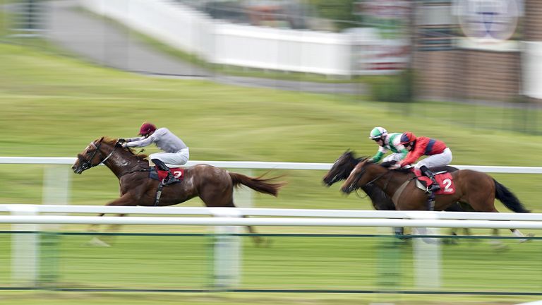 James Doyle riding Ebro River (left) coming home to win The Coral 'Beaten By A Length' National Stakes at Sandown Park Racecourse, Esher. Picture date: Thursday May 27, 2021.