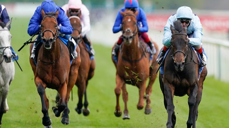 Andrea Atzeni riding Primo Bacio (R, light blue) to victory at York