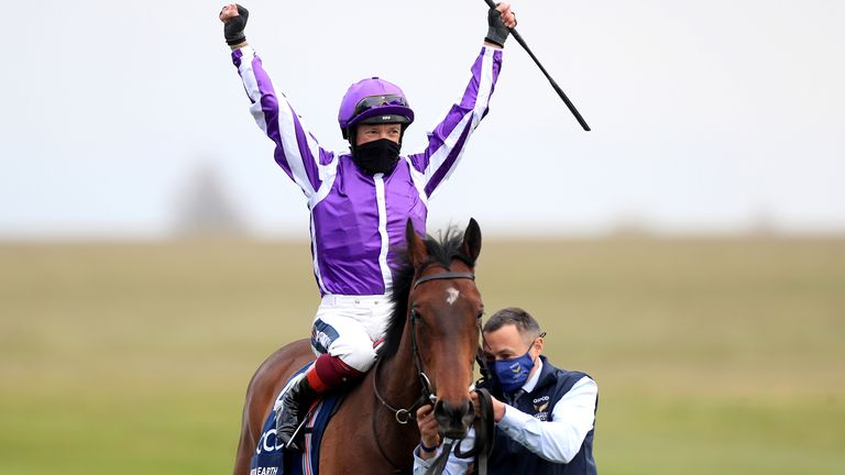 Frankie Dettori celebrates on Mother Earth after winning the Qipco 1000 Guineas Stakes