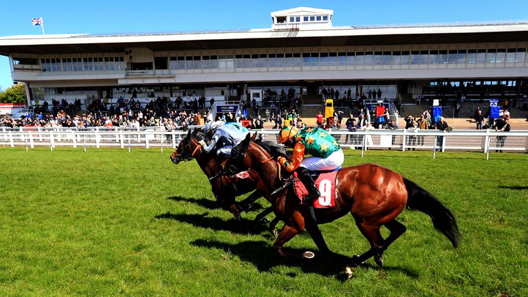 Racegoers watch the runners and riders at Redcar