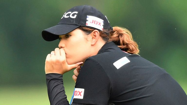 Ariya Jutanugarn of Thailand wait for putt on 18th hole during the final round of the LPGA Honda Thailand golf tournament in Pattaya, southern Thailand, Sunday, May 9, 2021.(AP Photo/Kittinun Rodsupan)