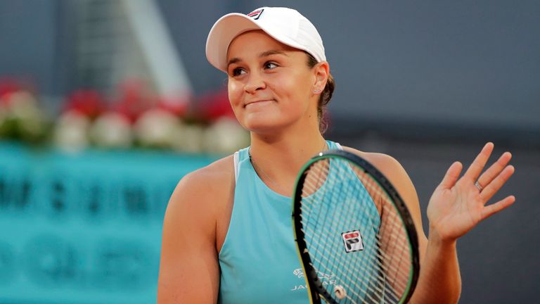 Ashleigh Barty of Australia celebrates after defeating Iga Swiatek of Poland during their match at the Madrid Open tennis tournament in Madrid, Spain, Monday, May 3, 2021. (AP Photo/Paul White)..