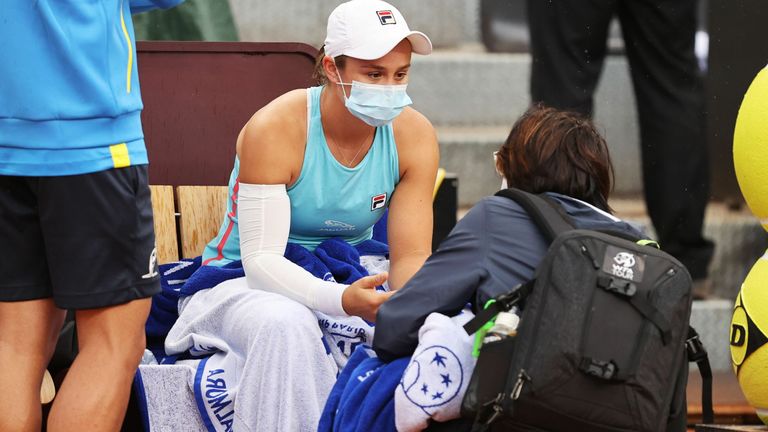 Ashleigh Barty of Australia chats to the trainer while playing Coco Gauff of the USA during their match on Day Seven of the Internazionali BNL D'Italia at Foro Italico on May 14, 2021 in Rome, Italy. Sporting stadiums around Italy remain under strict restrictions due to the Coronavirus Pandemic as Government social distancing laws prohibit fans inside venues resulting in games being played behind closed doors. (Photo by Clive Brunskill/Getty Images)