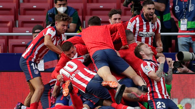 Atletico Madrid celebrate after Luis Suarez's late winner