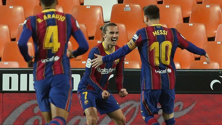 Barcelona moved to within two points of Atletico by beating Valencia