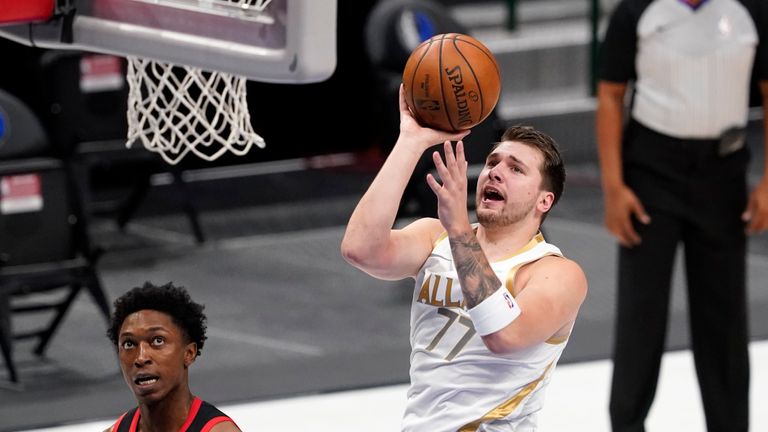 Luka Doncic contributed 20 points, 11 assists and 10 rebounds as Dallas beat Toronto.