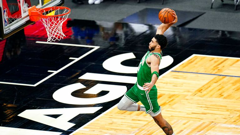 Boston Celtics forward Jayson Tatum goes up for an uncontested dunk during the first half of an NBA basketball game against the Orlando Magic, Wednesday, May 5, 2021, in Orlando, Fla. (AP Photo/John Raoux)