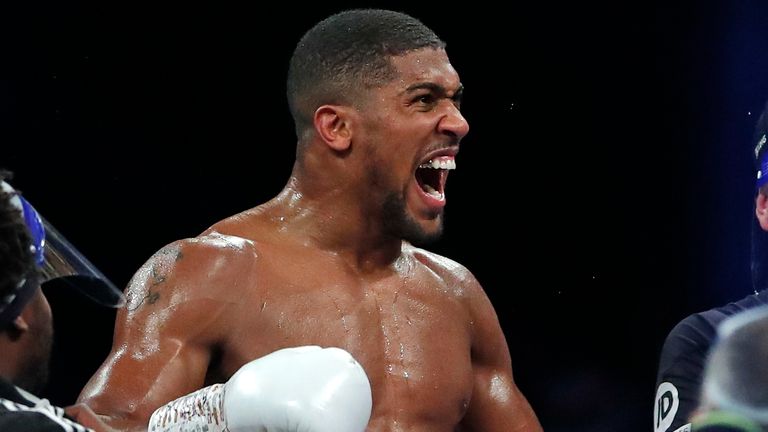 World Heavyweight boxing champion Britain's Anthony Joshua celebrates after beating challenger Bulgaria's Kubrat Pulev in their Heavyweight title fight at Wembley Arena in London Saturday, Dec. 12, 2020. (Andrew Couldridge/Pool via AP)



