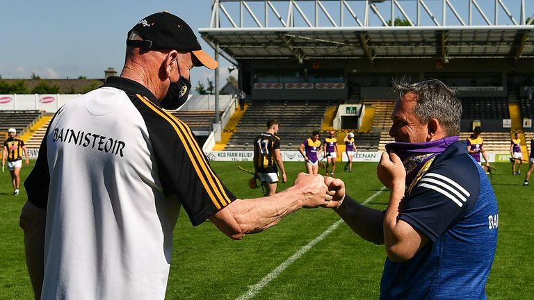 Brian Cody and Davy Fitzgerald share a fist-bump at full-time