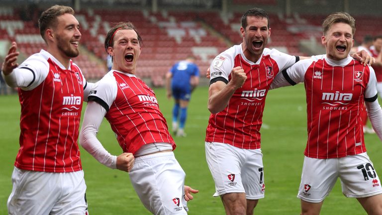 Callum Wright celebrates after scoring Cheltenham's fourth goal with his team-mates