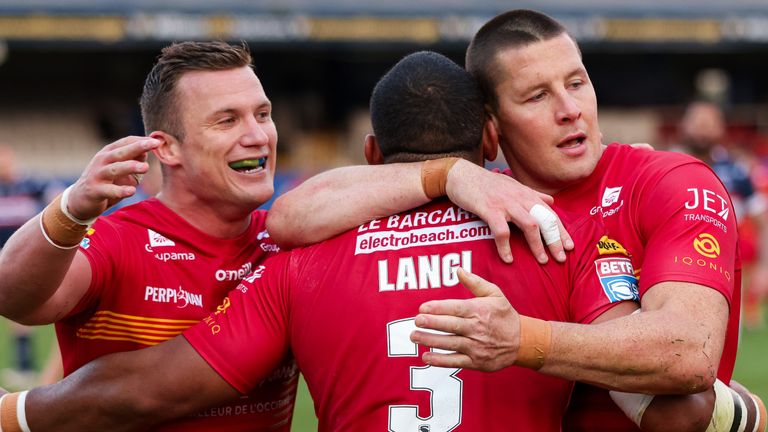 Picture by Alex Whitehead/SWpix.com - 30/04/2021 - Rugby League - Betfred Super League - Wakefield Trinity v Catalans Dragons - Mobile Rocket Stadium, Wakefield, England - Catalans' Samisoni Langi is congratulated on his try by Josh Drinkwater and Joel Tomkins.