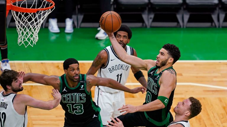 Boston Celtics forward Jayson Tatum drives to the hoop past Brooklyn Nets&#39; Blake Griffin in Game 3 of the first-round playoff series