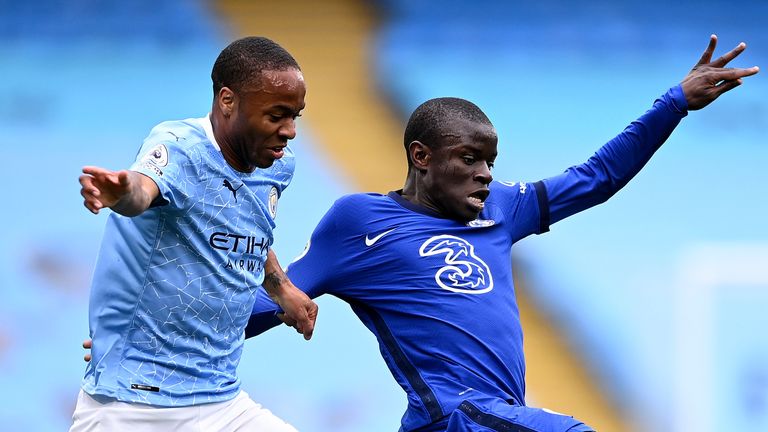 Manchester City's Raheem Sterling and Chelsea's N'Golo Kante challenge for the ball