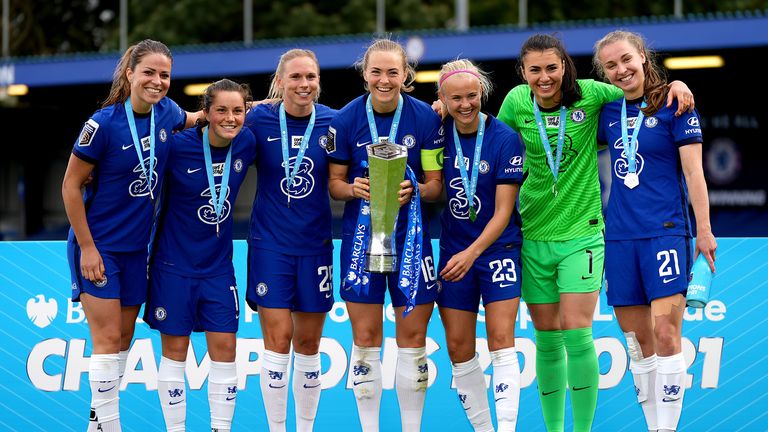 Chelsea's Melanie Leupolz, Jessie Fleming, Jonna Andersson, Magdalena Eriksson, Pernille Harder, Zecira Musovic and Niamh Charles celebrate with the FA Women's Super League trophy during the FA Women's Super League match at Kingsmeadow, London. Picture date: Sunday May 9, 2021.