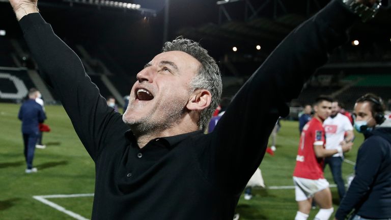 Lille head coach Christophe Galtier celebrates winning the French League.