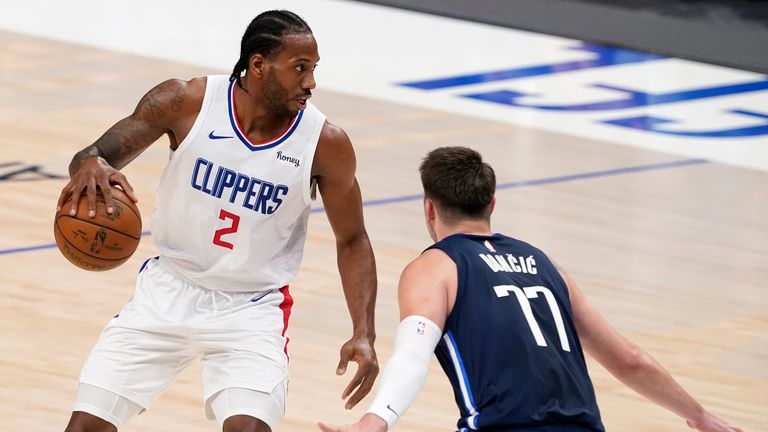 Los Angeles Clippers&#39; Kawhi Leonard looks for an opening to the basket as Dallas Mavericks&#39; Luka Doncic defends in Game 3 of an NBA basketball first-round playoff series