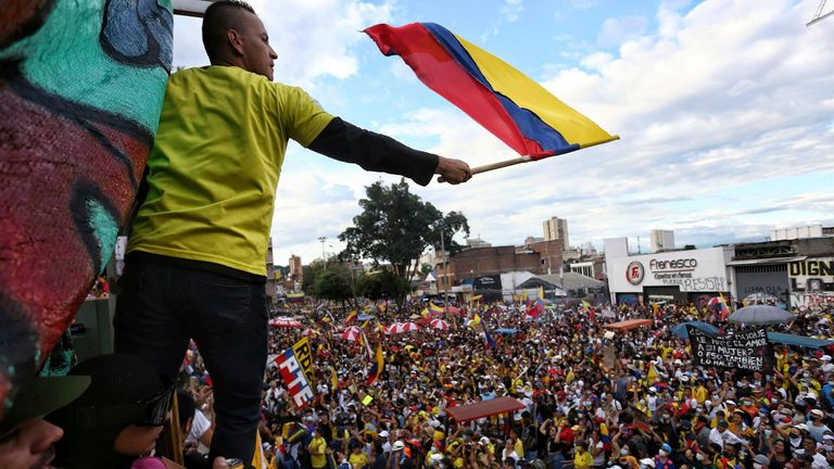 AP - flag bearer Colombia protests